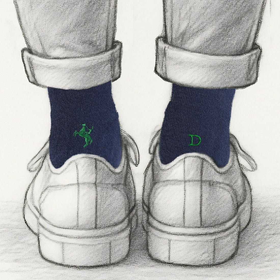 regalo per chi va a cavallo: calze blu Individual Socks con il fantino ricamato in verde su una calza e l'iniziale sull'altra